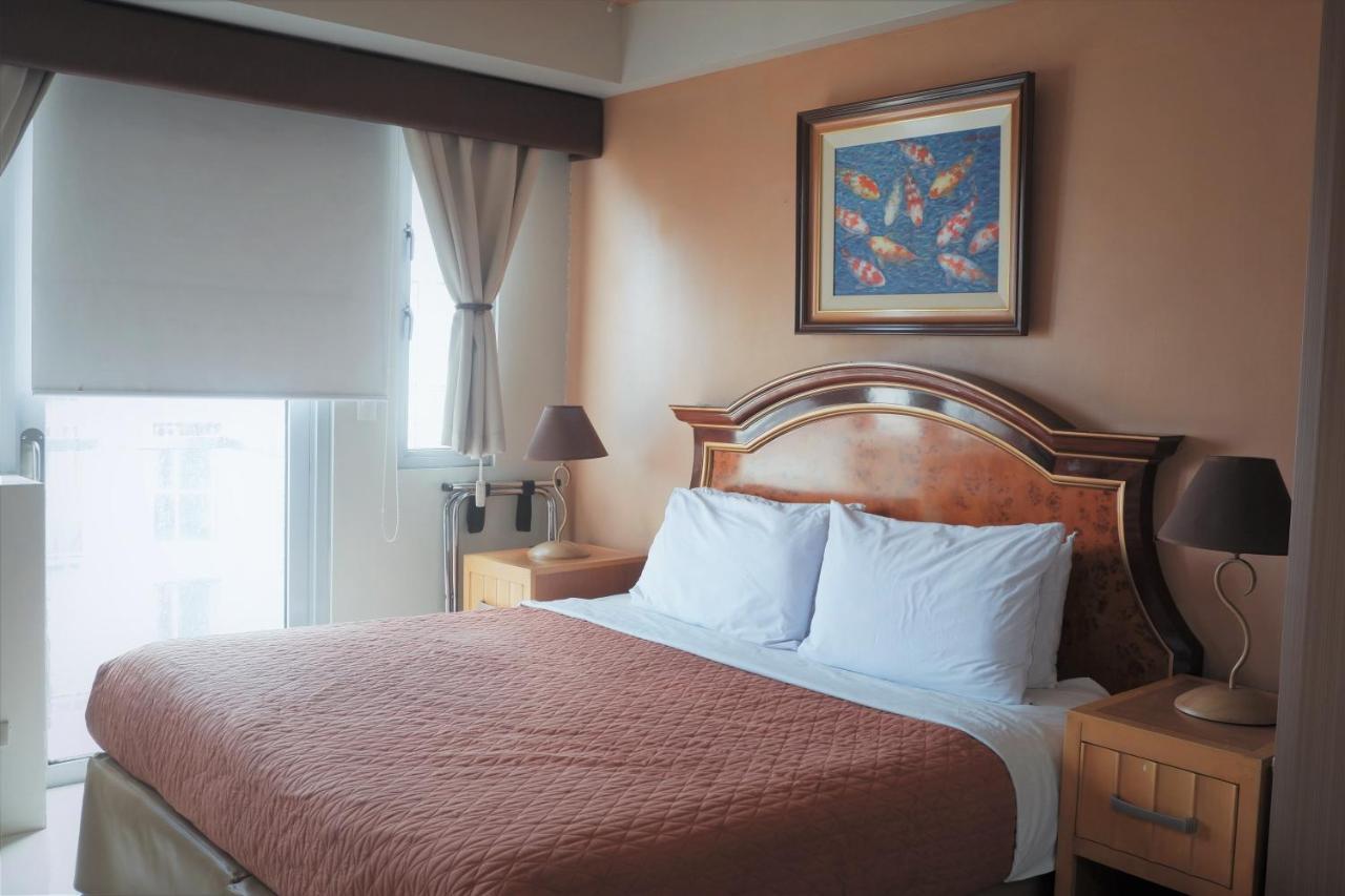 One Palm Tree Villas Manila Bagian luar foto